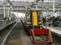 380 107 waits to leave Waverley platform 4 with a service to North Berwick on 24 September. The east end of the station has become much brighter with renewal of the roof and removal of related partitions and scaffolding.<br><br>[Bill Roberton 24/09/2012]