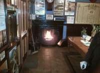 A welcome in the Valley - this roaring fire greeted visitors to Hampton Loade booking office during the SVR Autumn Gala on 22nd September. The effect was slightly diluted by the door being open. The display of posters on the walls is very nice, but there were probably quite a few less in BR days!<br><br>[Ken Strachan 22/09/2012]