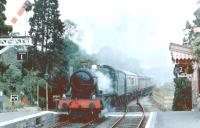 GWR Modified Hall 4-6-0 no 6960 <I>Raveningham Hall</I> comes south non-stop through Hampton Loade in 1980. The local signal box was switched out on this occasion. <br><br>[Colin Miller //1980]