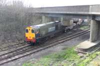 The driver of 20309 looks back towards his colleague operating the Heysham Power Station ground frame as he leaves with a nuclear reprocessing load on 6 March 2012. Once the train has cleared the points, and they have been reset for the line to Heysham Port passenger station, the guard will climb aboard 20308 on the rear. [See image 37915]<br><br>[Mark Bartlett 06/03/2012]