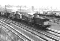 A dull and overcast Autumn day in Motherwell in 1970, contributed to in no small way by a pair of Claytons struggling past with a freight. Lead locomotive is Polmadie's D8558, finally withdrawn at the end of the following year.<br><br>[John Furnevel 30/10/1970]