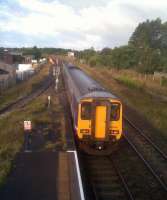 156484 leaves Wigton with the 08.01 Northern Rail service to Whitehaven on 17 September 2012. Semaphore signals are still alive and well here. The permanent way stabling line runs off to the left.<br><br>[Brian Smith 17/09/2012]