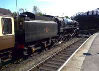 A trio of photographers perched on the overbridge concentrating on BR Standard class 9F 2-10-0 no 92214 <I>Cock O' The North</I> as it drifts into Pickering station on a bright and sunny September afternoon in 2012.<br><br>[John Steven 04/09/2012]