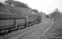 A BR class 9F 2-10-0 with empty iron ore hoppers returning to Tyne Dock. Photographed near Beamish on 10 April 1965.<br><br>[K A Gray 10/04/1965]