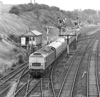 Non train heating boiler class 47 No. 47322 away from its usual freight duty haunts on 19 July 1975. The locomotive is passing Goose Hill Junction, Normanton, with the summer Saturday 09.10 Tenby - York.<br><br>[Bill Jamieson 19/07/1975]