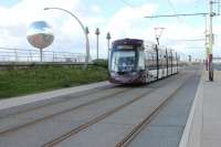 Blackpool never does <I>ordinary</I> and among the sculptures alongside the tramway on the sea wall is <I>The World's largest glitterball. Flexity</I> 012 heads for Little Bispham past the revolving ball, which is a year round feature and not just for the illuminations.<br><br>[Mark Bartlett 11/09/2012]