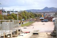 View east along the tram route from Edinburgh Park with a 170 unit passing on the parallel E&G.<br><br>[Bill Roberton 02/10/2012]