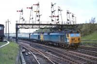 Class 50s Nos. D412 and D448 bring the 14.00 Glasgow Central to London Euston under the impressive signal gantry to the north of Carstairs station on 23 May 1970. The double heading of these locos on WCML expresses had only started at the timetable change less than three weeks previously. <br><br>[Bill Jamieson 23/05/1970]