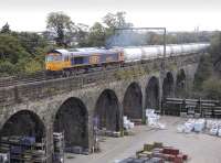 GBRf 66735 accelerates away from a signal check at Slateford Junction on 2 October and crosses the Water of Leith viaduct with the 6S45 North Blyth - Fort William Alcan service.<br><br>[Bill Roberton 02/10/2012]