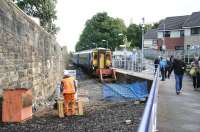 Passengers leaving Paisley Canal station on 28 September shortly after the arrival of the 14.03 service from Glasgow Central. Works in connection with the forthcoming electrification are apparent here - as at other locations along the branch.<br><br>[John Furnevel 28/09/2012]