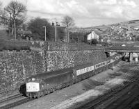 45150 has just passed through Marsden station with a train for Liverpool Lime Street. It will be braking for the sharp 40mph curve on the eastern approach to Standedge Tunnel. Thought to have been taken in late autumn 1983.<br><br>[Bill Jamieson //1983]