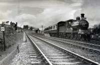 GNSR 49 pauses before joining the mainline again at Inveramsay with the 1960 RCTS/SLS Joint Scottish Tour. Today the platforms remain here but the branch line is completely lifted and mainline reduced to a single track. The line to Aberdeen is behind the camera.<br><br>[WA Camwell (Copyright Stephenson Locomotive Society) 13/06/1960]