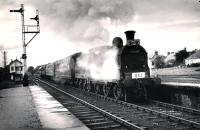 The 1960 RCTS/SLS Joint Scottish Tour leaves the Fortrose branch at Muir of Ord rejoining the Thuro and Wick to Inverness mainline. <br><br>[WA Camwell (Copyright Stephenson Locomotive Society) 14/06/1960]