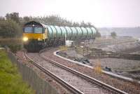 Colas 66847 passes a very wet Culross with the 6N72 Linkswood - Grangemouth empty tanks on 11 October 2012.<br><br>[Bill Roberton 11/10/2012]