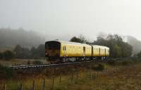 With the morning mist beginning to clear and the grass still showing signs of an overnight frost, Network Rail's Track Assessment and Recording Unit No. 950001 is pictured between Locheilside and Glenfinnan bound for Mallaig.<br><br>[John Gray /10/2012]