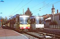 Tram-trains Nos. 828 and 836 belonging to the Albtal Verkehrs Gesellschaft (AVG) stand in Odenheim station, terminus of the branch from Bruchsal, on a bright summer evening in August 2000. Set No. 828 is about to depart on an evening service to Karlsruhe, where it will terminate in the Hauptbahnhof, so there will be no need to go into tram mode.<br><br>[Bill Jamieson 12/08/2000]