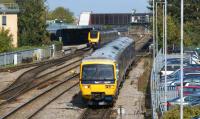 A northbound CrossCountry Voyager calls at Oxford on 22 September 2011, just as First Great Western 166205 sets off in the opposite direction with a service for Paddington.<br><br>[John McIntyre 22/09/2011]