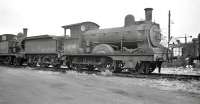 GER Holden E4 2-4-0 no 62797 on the condemned line at Stratford in 1958. Withdrawn from Cambridge in March that year, the locomotive was cut up at Stratford Works five months later. <br><br>[K A Gray //1958]