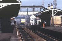 DMU approaching Gobowen station in March 1985. View north towards Chirk Road level crossing.<br><br>[Ian Dinmore /03/1985]