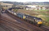 BRCW Type 2s Nos. D5301 and D5302 bring a loaded Seafield Colliery to Cockenzie PS MGR coal train round the chord between Inverkeithing East and Central Junctions in October 1970. Some idea of the slickness of MGR operation can be judged from the fact that the empties had passed me at Dalmeny Junction less than two hours previously.<br><br>[Bill Jamieson 09/10/1970]