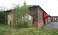 Part of the old goods yard at Ripon in April 2009, with several of the redundant buildings now put to use by private companies. View is south towards the exit on Hutton Bank, with the former station off picture to the right [see image 26739].<br><br>[John Furnevel 24/04/2009]