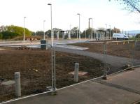 The new tram stop at Gogarburn, photographed from alongside the A8 on 21 October 2012 looking east towards the city centre. The rear of Gogar tram depot is just visible in the background beyond the van on the far right.<br><br>[John Furnevel 21/10/2012]