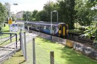 Corkerhill station is bathed in Autumn sunshine as the 13.05 Paisley Canal - Glasgow Central pulls away from the platform on 28 September 2012. Work on the electrification of the branch is due for completion by the end of this year.<br><br>[John Furnevel 28/09/2012]