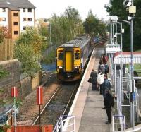 Arrival of the 14.03 service from Glasgow Central at Paisley Canal terminus on 28 September 2012. Activity in the background is in connection with branch electrification works.<br><br>[John Furnevel 28/09/2012]