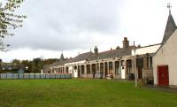 The former station a Aboyne on 18 October 2012 viewed from the east end. Although the former Up platform building no longer has a canopy, the corbels that supported it are quite clearly seen. Much of the trackbed here has been built over making it difficult to see where it used to be but at the west end the approach to the tunnel is easily found. The tunnel itself is in use as a rifle range and beyond that towards Ballater much of the tarckbed is used as the Deeside Way cycle and footpath.<br><br>[John McIntyre 18/10/2012]