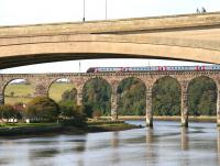 <I>'I see no ships... '</I> A couple standing on the Royal Tweed Bridge at Berwick looking out to sea on a fine, bright October afternoon, as a CrossCountry Voyager rumbles over the Royal Border Bridge in the background. The train is the 13.06 Edinburgh Waverley - Plymouth.  <br><br>[John Furnevel 09/10/2012]