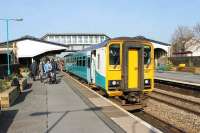 A Central Wales Line service for Shrewsbury, formed by ATW 153367, calls at Llanelli in March 2012. Although this is normally the westbound platform, all Central Wales services use it to reverse before leaving for Swansea or Shrewsbury via a crossover just beyond the station. <br><br>[Mark Bartlett 24/03/2012]