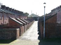 A Lancashire town with rows of terraced houses and the obligatory 'dark satanic mill' at the end of the street is a scene much associated with artist L S Lowry. This scene in 2012 is no different - other than for Lancashire read Northumberland and for 'dark satanic mill' read Tweedmouth shed. (Lowry was in fact a regular visitor to the area over the 40 years up to his death in 1976 and 'The Lowry Trail' is now a popular walking route around Berwick and Tweedmouth.)<br><br>[John Furnevel 07/10/2012]