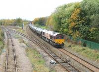 DBS 66204 passes Lostock Hall Junction with the (MWF only) Preston Dock to Lindsey bitumen empties on 31 October 2012. The lines to the left go to Farington Junction on the WCML and the train has just passed through Lostock Hall station in the background. <br><br>[Mark Bartlett 31/10/2012]