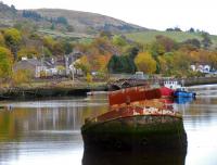 An MPV on <i>leaf train</i> duties heads east past Bowling Harbour. The view is from Frisky Wharf, the eastern extreme of the former Caledonian and Dumbartonshire Junction Railway. In the distant right a portion of viaduct on the closed Caledonian route can be seen. This harbour, built with money from the forfeited estates of the Jacobites, has for over a hundred years been the final resting place of vessels. It was also used for winter lay-over for part of the Clyde steamer fleet.<br><br>[Ewan Crawford 27/10/2012]