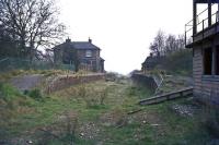 Nine years after closure, a discarded luggage trolley is still to be seen between the platforms at Long Melford in April 1976. Formerly a junction for the Stour Valley and Bury St Edmunds lines, this was the view towards Sudbury until new houses were built across the trackbed.<br><br>[Mark Dufton 11/04/1976]