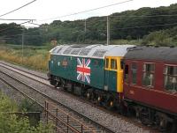A close up of the Diamond Jubilee embelishments to Stratford liveried 47580, seen here passing Woodacre on the rear of the returning <I>Mersey Moorlander</I> tour in August 2012. With former Royal train loco 47798 on the front the Brush 4s had taken over the train at Carnforth from Black 5 45305. <br><br>[Mark Bartlett 06/08/2012]