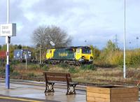 Freightliner 70007 comes off the Oxford line alongside Didcot station on 1 November 2012 hauling a trainload of containers bound for Southampton.<br><br>[Peter Todd 01/11/2012]