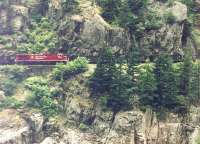 In the Fraser valley, CN and CPRS tracks run along either side of the river. <br>
'The Rocky Mountaineer' was running on CN tracks. Across the river, the <br>
CPRS locomotive is in the middle of what appears to be a coal train. Since <br>
these pictures were taken, there has been an agreement to share tracks <br>
for all eastbound services on one side and westbound the other.<br>
<br><br>[John Thorn /06/1998]