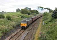 'Tagging along for the ride' on the back of a <I>Cumbrian Mountain Express</I> is <I>Royal</I> Brush Type 4 47798 <I>Prince William</I>. On this occasion the CME was hauled by newly repaired A4 60009 <I>Union of South Africa</I> [See image 40004] and the train is seen reaching the summit of Hoghton Bank heading for the Settle and Carlisle line via Blackburn and Clitheroe. <br><br>[Mark Bartlett 18/08/2012]