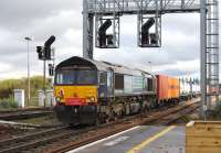 DRS 66416 secured to the rear of a container train hauled by Freightliner 66538 passing through Didcot station on 1 November 2012. (A banker perchance?)<br><br>[Peter Todd 01/11/2012]