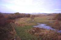 View north across the Waverley Route solum on 26th October towards Borthwick Bank signal box (beside the horses in the middle distance) and the Pentlands beyond. The wide grassy area in the right foreground is the remains of the 'reclaimed' land which formed the rail access to Borthwick Bank tip, which stretched away to the right.<br><br>[David Spaven 26/10/2012]