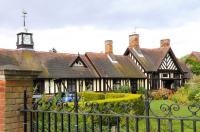 Station Clock and up-side buildings at Wolferton on 16 November 2012. View north east towards Hunstanton. <br><br>[Brian Taylor 16/11/2012]