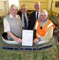 Irvine Station has been named Best Adopted Scottish Station 2012 by<br>
Passenger Focus, the independent watchdog. [See previous news item] The photograph shows (L-R) Tom Rout of Kyle Model Railway Club; ScotRail's external relations manager, John Yellowlees; Robert Samson, passenger manager (Scotland) for Passenger Focus, and Louis Wall of South West Station Gardeners Group. <br><br>[ScotRail 06/11/2012]