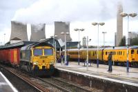 Freightliner 66538 with eastbound containers through Didcot station on 1 November 2012 passing a Network Rail test train stabled alongside in the north sidings.<br><br>[Peter Todd 01/11/2012]