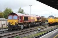 DBS 66001 at Didcot on 1 November 2012 with a 'train' for the local Ministry of Defence depot.<br><br>[Peter Todd 01/11/2012]