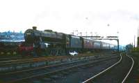 Black 5 no 44703 takes a Glasgow train south out of Stirling in 1965 and is about to pass Stirling South MPD. Stirling Middle signal box stands in the right background. The locomotive was withdrawn by BR in December the following year and cut up at McWilliams, Shettleston, in April 1967.<br><br>[Robin Barbour Collection (Courtesy Bruce McCartney) //1965]