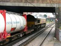 The 15.50 Purfleet - Wembley freight rumbles through Dalston Kingsland station on the North London Line on 21 July 2005 behind EWS 66142. The train is about to pass Western Junction signal box [see image 5172].<br><br>[John Furnevel 21/07/2005]