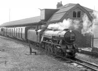 A train waits at the platform at Dungeness on the Romney, Hythe and Dymchurch Railway in 1967. The locomotive is Mountain class 4-8-2 No 5 <I>Hercules</I> [Davey Paxman 16041/1927]. This locomotive hauled the inaugural train from Hythe on the opening day of the line on 16 July 1927. <br><br>[Robin Barbour Collection (Courtesy Bruce McCartney) //1967]