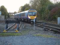 185136 forming the 15.50 Middlesbrough to Manchester Victoria via the Calder Valley line on 27 October, during the 10-day engineering blockade at Stalybridge. The train is approaching Northallerton station past engineers sidings just west of Low Gates level crossing and the former Northallerton Town station. Note the yellow painted ends to the siding rails. <br><br>[David Pesterfield 27/10/2012]