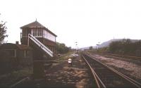 View west past Plumpton Junction signal box towards Ulverston in July 1987. Hoad Monument stands on Hoad Hill in the right background.<br><br>[Ian Dinmore /07/1987]